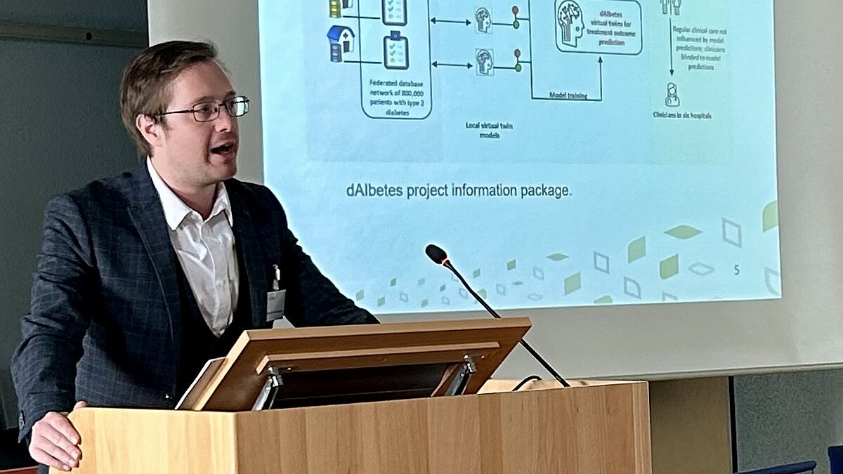 Dr David M.Schneeberger (Research Institute – Digital Human Rights Center, Vienna) standing on the podium.