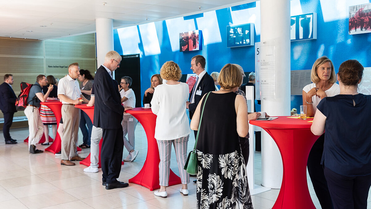 People at high tables.